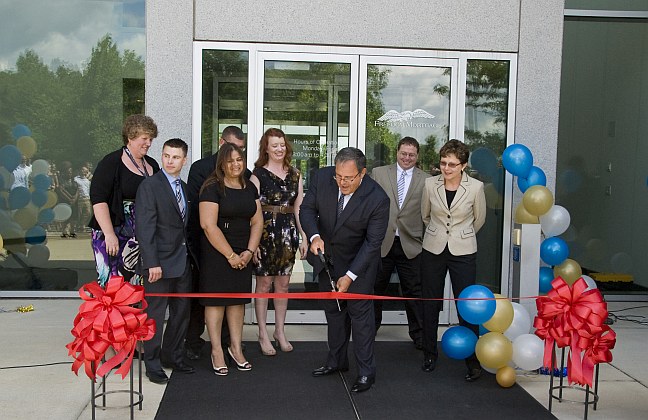 Freedom Mortgage Corporation President and CEO Stanley C. Middleman cuts ribbon at launch of the Fishers, IN Servicing Center.